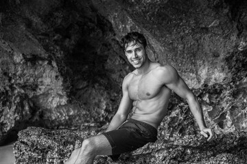 Canvas Print - Handsome young man standing on a beach in Phuket Island, Thailand