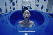 woman in the blue tint bathroom, 