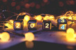 happy new year 2024 concept banner, flip calendar numbers 2023 to 2024 on steel cube blocks isolated on bokeh lights background.