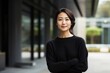 © Leon Waltz - Portrait of a beautiful asian businesswoman smiling at the camera