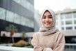 © Leon Waltz - Portrait of a beautiful young asian muslim woman wearing hijab smiling at the camera