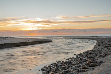 Poster - Aerial view of sea waves breaking beach during sunset