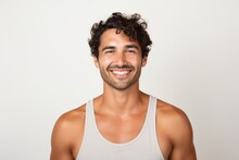 Portrait Of A Brazilian Man In His 30s In A White Background Wearing A Sporty Tank Top