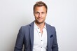 © Eber Braun - Portrait of a young businessman in a suit on a white background