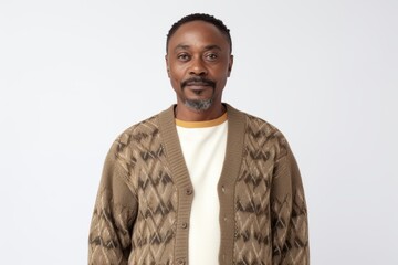 Wall Mural - Portrait of an African-American man in a sweater on a white background