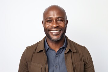 Wall Mural - Portrait of handsome african american man smiling at camera over white background