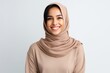 © Hanne Bauer - Portrait of a Saudi Arabian woman in her 20s in a white background wearing a cozy sweater