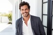 © Eber Braun - Portrait of smiling businessman in suit standing in doorway at new office