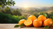 Fresh Oranges With Leaves On Wooden Table In Front Of Blurred Nature Background