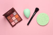 © splitov27 - Make-up puff and sponge for removing makeup, eye shadow palette, brush on a pink background. Beauty products