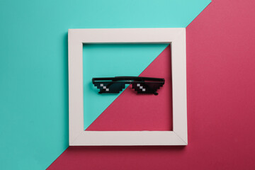 Wall Mural - 8 bit pixel sunglasse in white frame on pink blue background. Creative layout. Minimalism