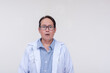 © Mdv Edwards - A doctor looking baffled and shocked, mouth wide open. Of asian descent, middle aged male. Isolated on a white background.