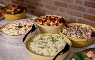 Canvas Print - Closeup of the delicious-looking colorful salads with many healthy ingredients on the table