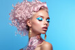 © Ivan - Beautiful beauty or fashion portrait of a woman with makeup with pink curly hair on a beautiful blue background