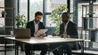 © Yuliia - Moving camera diverse partners in office sign contract handshake cooperation Multiethnic Caucasian and African American business people men sit at desk signing document shake hands success partnership