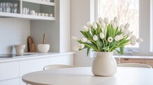  A White Vase Filled With White Flowers On Top Of A Table.  Generative Ai