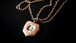 He delicately places a golden locket on a chain around his neck.