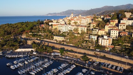 Canvas Print - Drone shot of boats near the docks of the harbor next to Bordighera, Italy