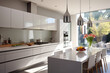 Monochromatic kitchen with crisp white walls and cabinets. White quartz countertops, garden view from window
