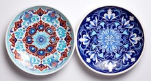 Set Of Two Ceramic Plates With Floral Ornament On A White Background