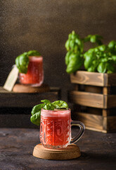 Wall Mural - watermelon drink with basil on a dark background