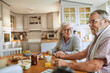 © Marko Geber - Senior caucasian couple having breakfast together at home
