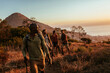 © Marko Geber - Diverse group of young friends hiking in the mountains together