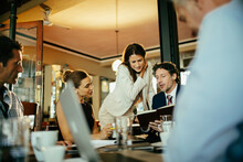 Group Of Business People Having A Meeting In A Cafe Bar