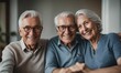 © ibreakstock - Elderly couple and friend smiling and enjoying time together at home