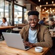 © Yulia - Happy African American student doing his online homework at urban cafe. Generative ai