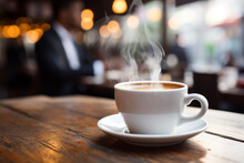 Drink Steaming Coffee At A Cafe Where Businessmen Gather Before Commuting To Work Business People Who Are Busy With Work Gather Blurry Scenes. Good Working Concept For Work And Rest.