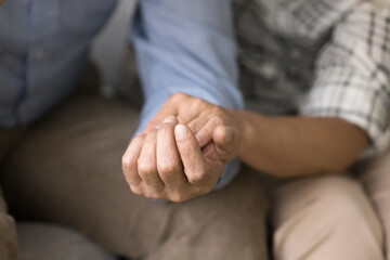 Wall Mural - Old couple sharing stress, problems, going through crisis together. Senior husband and wife holding hands, giving comfort, support, empathy, consoling each other. Close up of arms