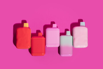 disposable vape, electronic cigarettes, smoking devices on a pink background