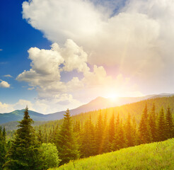 Wall Mural - High mountains and sun on sky