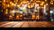 tabletop with bokeh lights of an evening restaurant background.