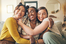 Portrait Of A Group Of Women, Friends Hug On Sofa With Smile And Bonding In Living Room Together In Embrace. Hug, Love And Friendship, Girls On Couch With Diversity, Pride And People In Home With Fun