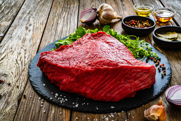 Poster - Fresh raw beef meat on cutting board
