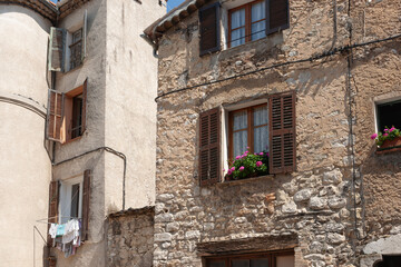 Sticker - Old stone residential building in street in ancient town