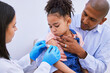 © LuneVA/peopleimages.com - Doctor, father and child with plaster for vaccine, flu shot or medicine injection in clinic or hospital. Dad, girl with bandage and pediatrician in office for vaccination, consultation and healthcare
