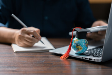 Graduation cap with Earth globe. Concept of global business study, abroad educational, Back to School. Education in Global world, Study abroad business in universities in worldwide. language study