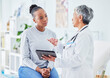 © LuneVA/peopleimages.com - Doctor, woman and tablet for hospital, healthcare advice and support for results, exam and test on bed. Senior expert or medical people on digital tech for clinic sign up, registration and consulting