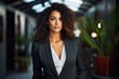 Beautiful woman wearing a structured blazer , Elegance of business female at work with wavy hair