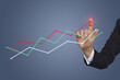 © aorphoto - Hand touching graphs of financial indicator and accounting market economy analysis chart, business strategy concept. businesswoman with financial symbols coming from hand.