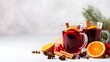 © petrrgoskov - Christmas mulled red wine with spices and fruits on a white background. Traditional hot drink at Christmas time