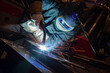 © zilber42 - welder is welding metal part in car factory