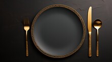 Elegant Black Plate With Gold Knife And Fork Top View 