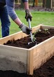 Man working with soil on raised bed garden, home gardening and farming concept, generative ai