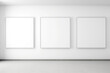 Three empty frames on a white wall, mockup for presenting art or design works