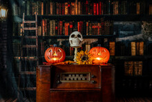 Vintage Radio Decorated For Halloween
With Jack-o-lanterns And Skull With Old Library Background