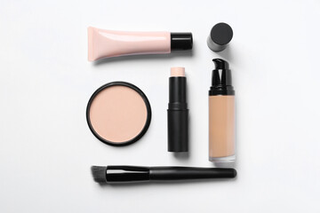 Poster - Different types of skin foundation on white background, flat lay. Makeup product